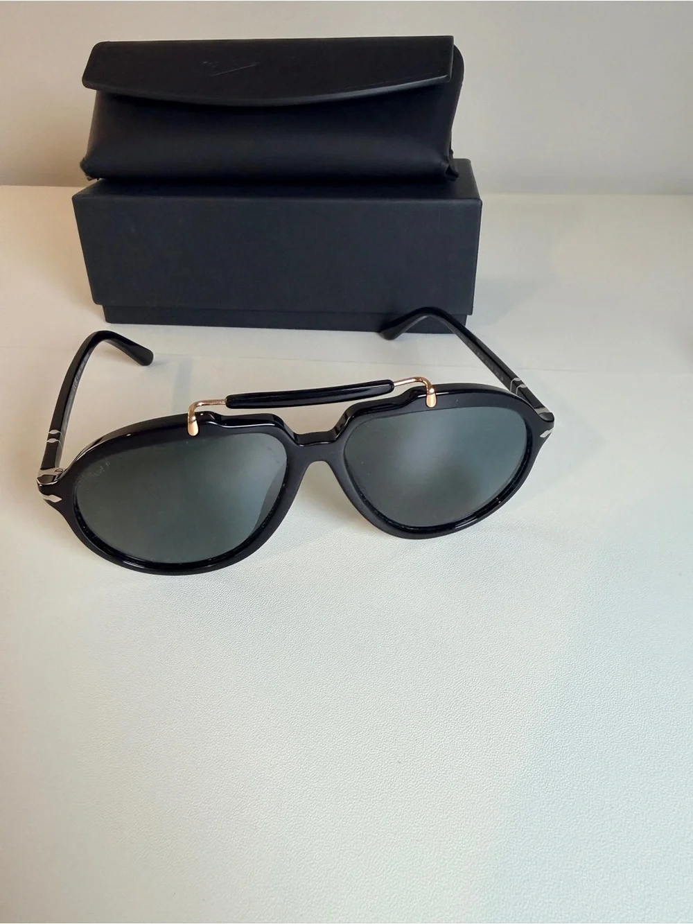 Persol Polarized Sienna Black Sunglasses with Gold Accents and Dark Lenses
